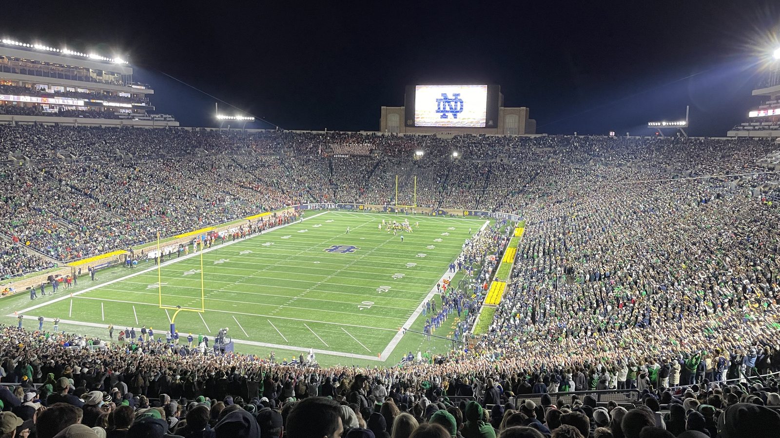 Notre Dame Stadium lit up at night in South Bend